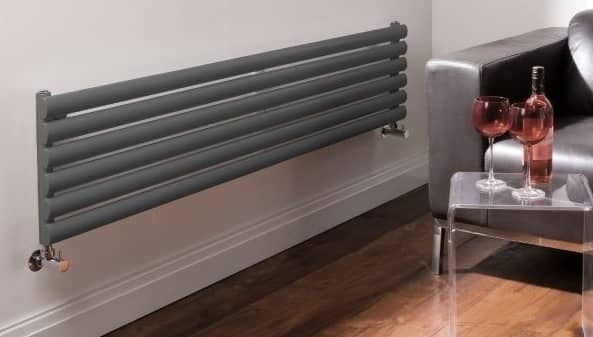 horizontal anthracite radiator on white wall
