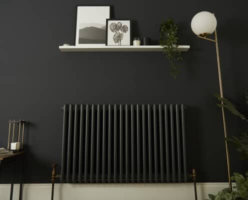 a dark radiator on a black wall